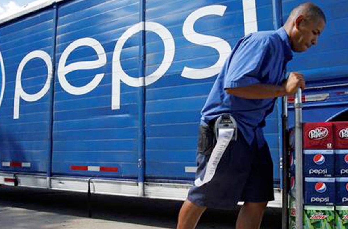 pepsi truck driver toting away product