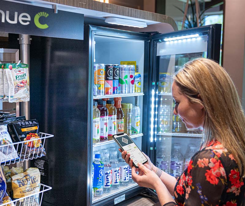 woman using app and shopping in a mini market